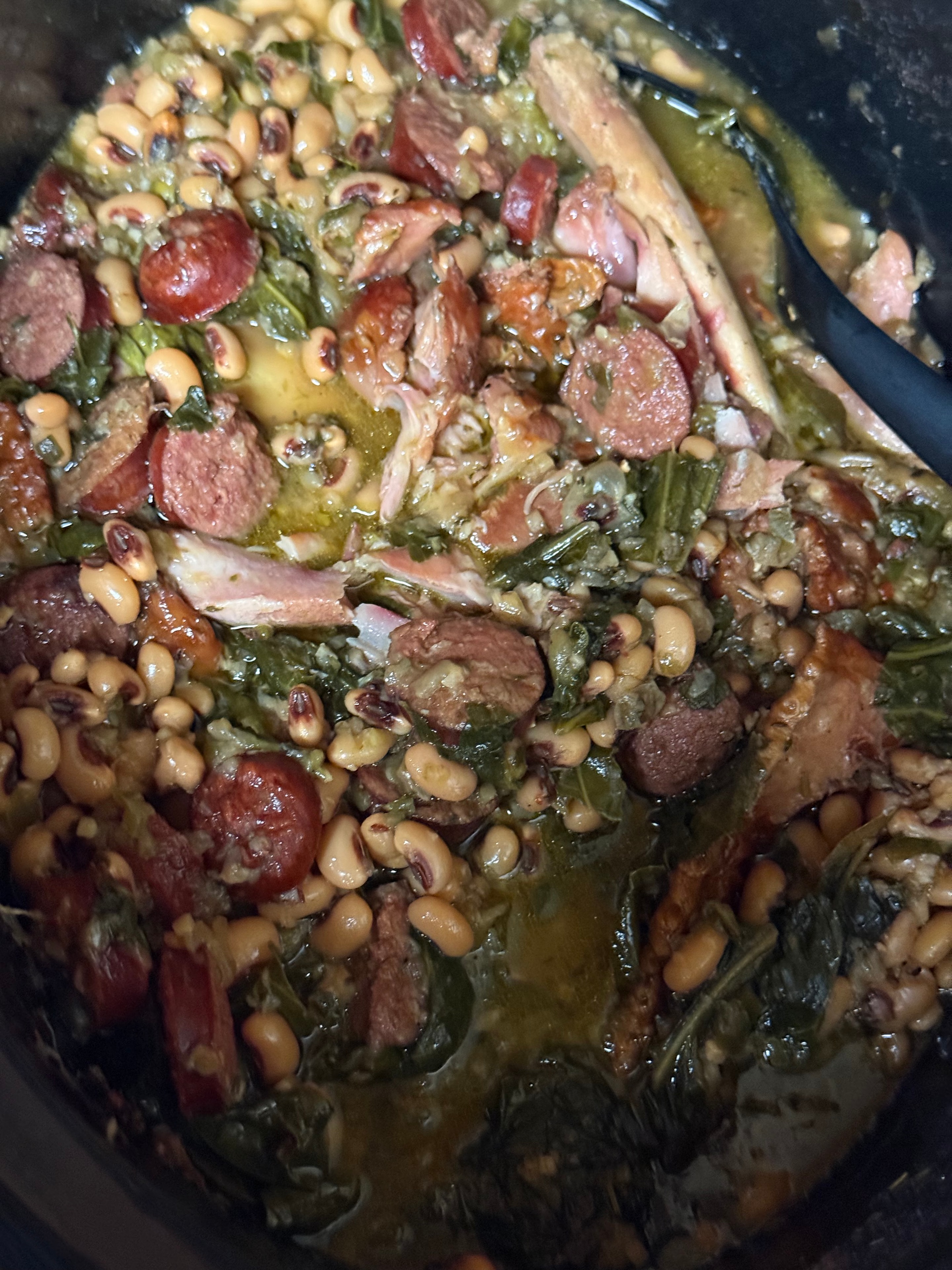 Black eyed peas with sausage, greens and smoked meat